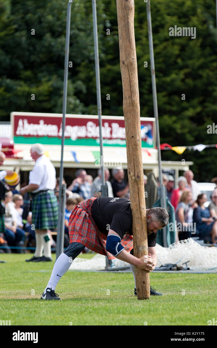 Ballater, Scotland - Aug 10, 2017: A competitor in the caber toss, a ...