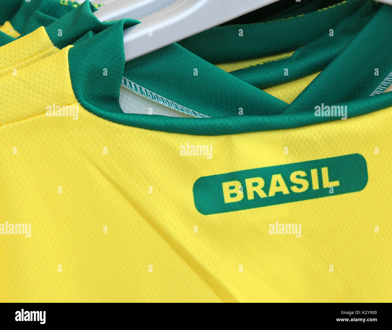 Football t-shirts with the text BRASIL which means Brazil for sale in the specialized sports shop Stock Photo