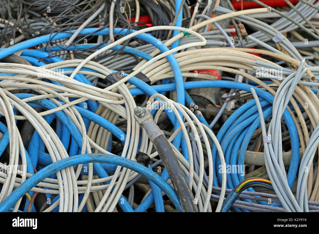 many copper cables with plastic insulation in the dump of polluting and