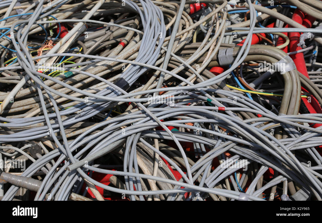 abandoned electrical wires in a recyclable material to landfill Stock
