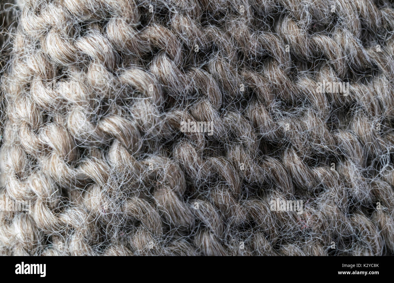 highly detailed needlework wool fabric, close up wool texture background. Stock Photo