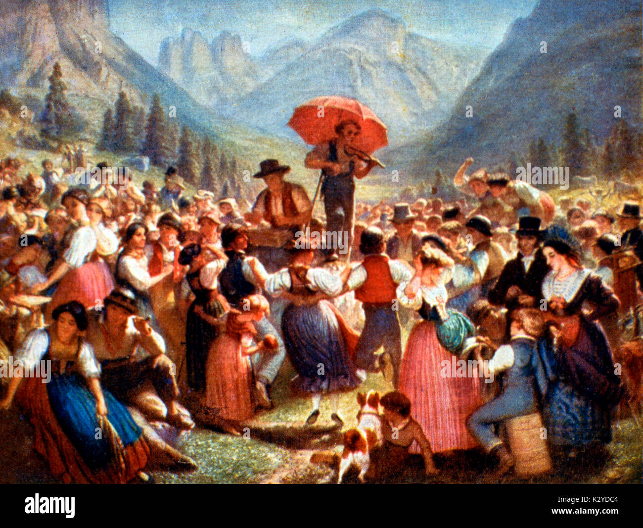DANCE - SWITZERLAND Villagers dancing in the mountains folk dance - music on violin Stock Photo