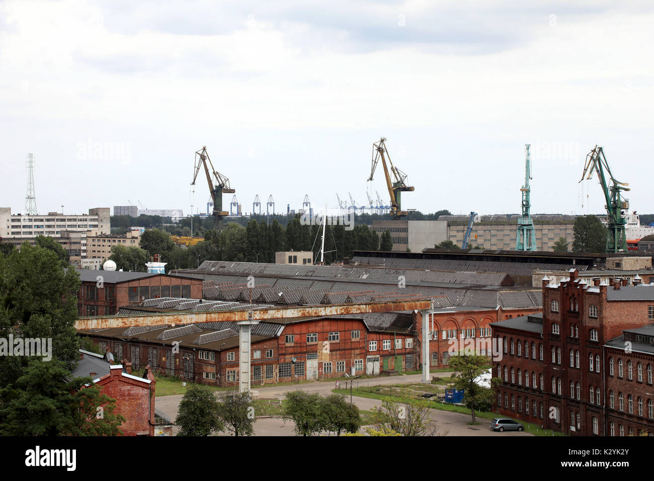 Warehouses and cranes dominate the landscape around the Port of Gdańsk, Poland on 20 August 2017. Stock Photo