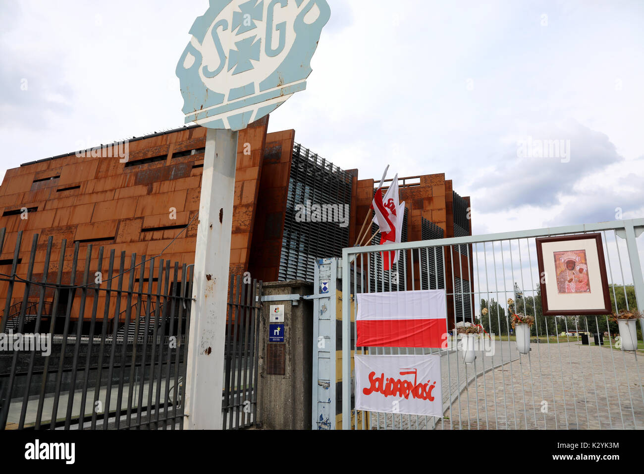 The entrance to the Gdańsk Shipyards, with  Polish flags and banners bearing the logo of the Solidarity (Solidarność) union, in Gdańsk, Poland on 20 A Stock Photo