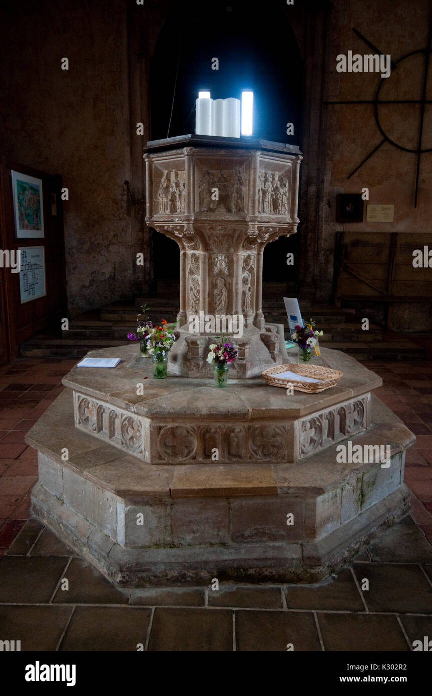 The font inside the Priory Church of St Mary and the Holy Cross at Binham in Norfolk, UK Stock Photo