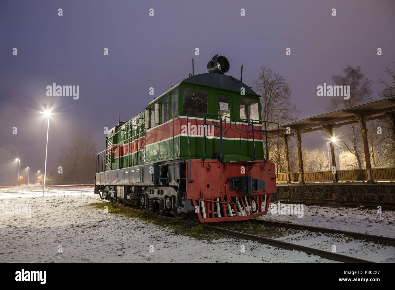 Old train at vintage station. Winter time. Stock Photo