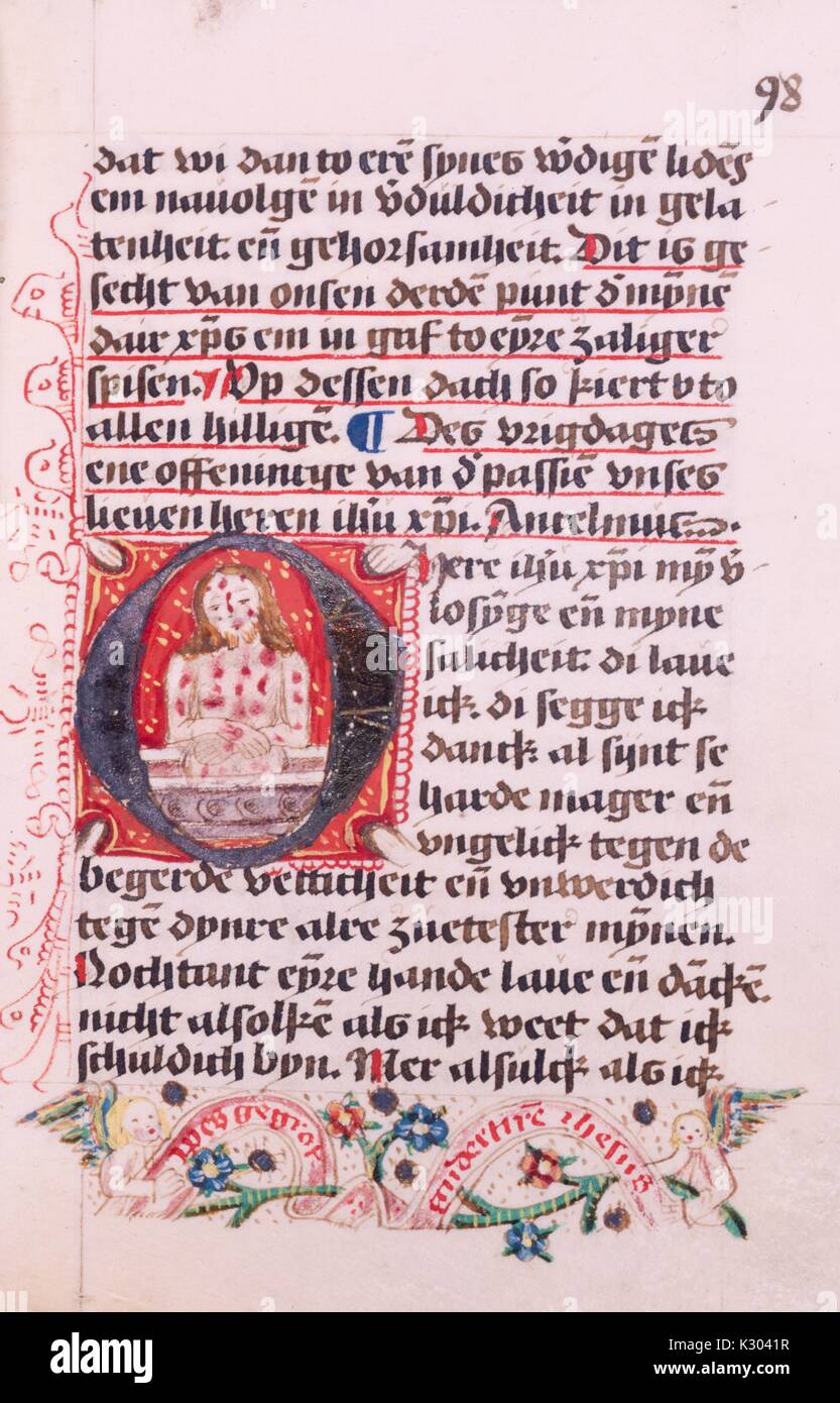 Illuminated manuscript page displaying text and an illustration of the wounded Christ with sigmata, from a 15th century manuscript book in Dutch, 1450. Stock Photo