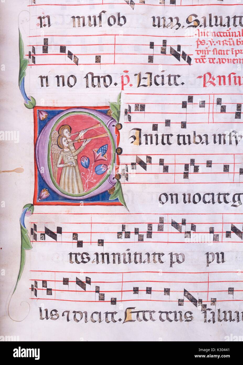 Illuminated manuscript page containing illustrated sheet music with two angels blowing into horns, from a 15th century Latin manuscript book, 1450. Stock Photo