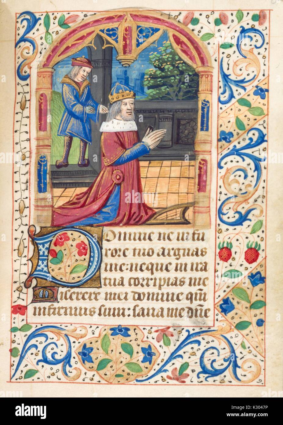 Illuminated manuscript page depicting a king praying on his knees, from the 'Initium sancti euangelii secundum iohannem, gloria tibi domine, ' a 15th century Latin book of hours, 2013. Stock Photo