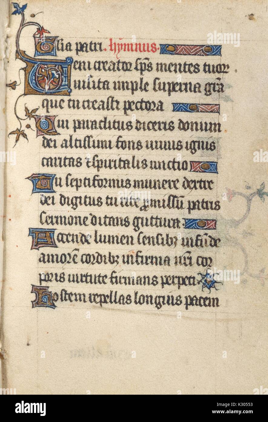 Illuminated manuscript page of prayer in Latin with ornamental initials, from the 'Gloria patri hymnus, ' a 15th century Latin book of hours, 2013. Stock Photo