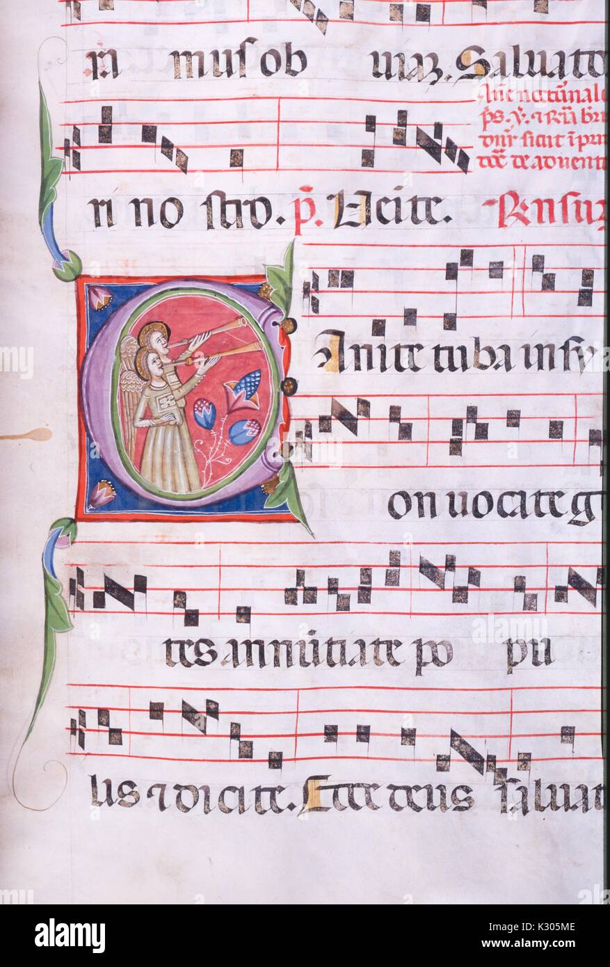 Illuminated manuscript page of song with angels playing horns, from the 'Incipit antiphonarium nocturnum, ' a 15th century Latin antiphonary from the Catholic Church, 2013. Stock Photo