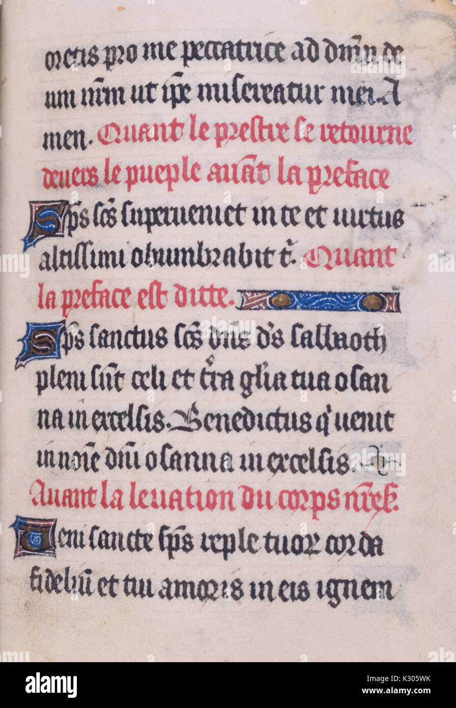 Illuminated manuscript page of prayer in Latin with ornamental initials and detailing, from the 'Gloria patri hymnus, ' a 15th century Latin book of hours, 2013. Stock Photo