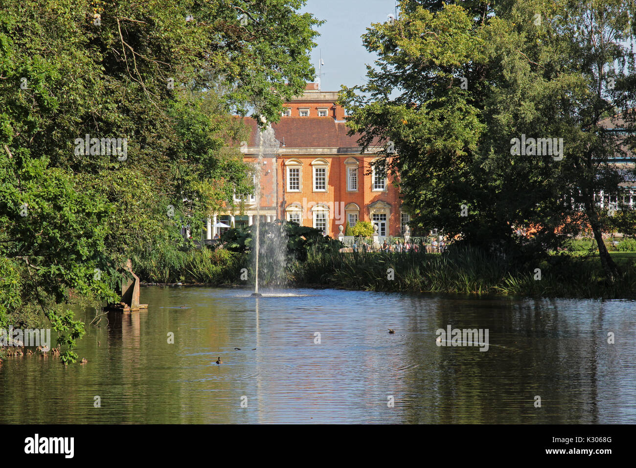 A view down the lake at South Hill Park Arts Centre with the fountain
