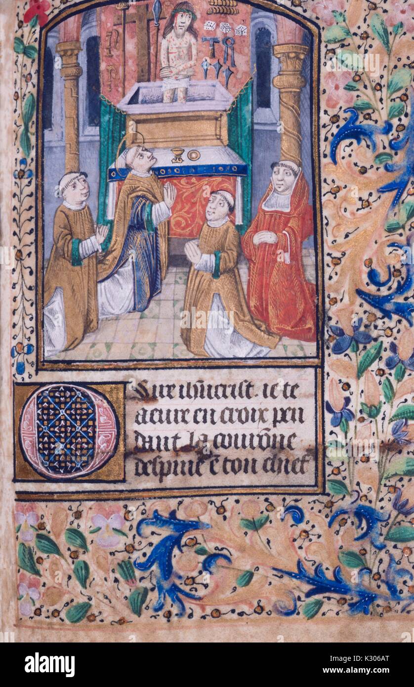 Illuminated manuscript page from 'Horae Beatae Virginis' with saints praying, 1300. Stock Photo
