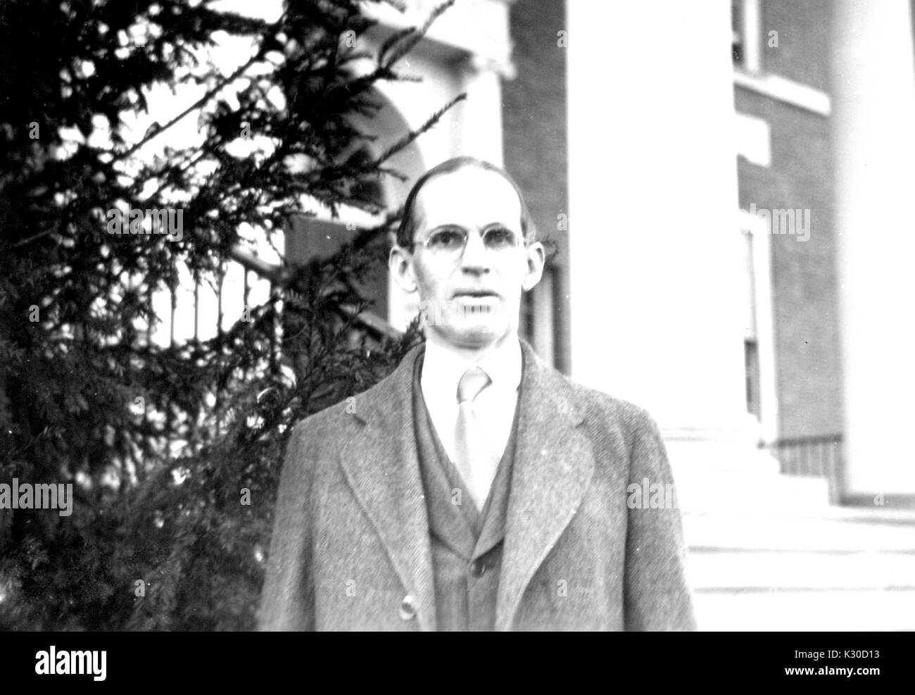 Visiting professor of jurisprudence at Johns Hopkins University, Walter Wheeler Cook poses for his photograph outside the front steps of Gilman Hall, a science and humanities building on campus, Baltimore, Maryland, 1928. Stock Photo