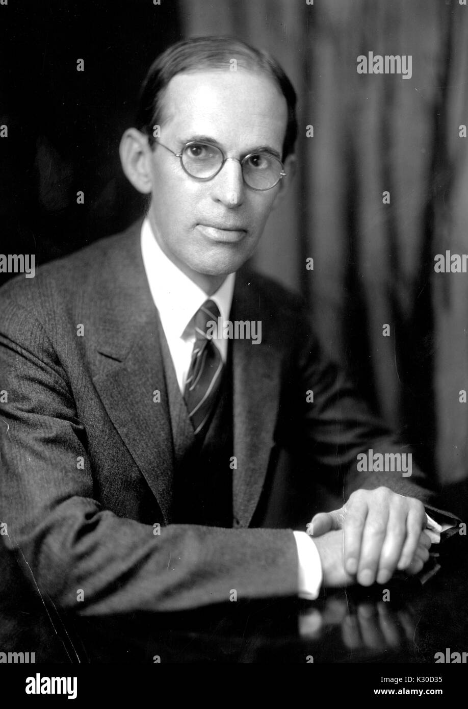Portrait of Walter Wheeler Cook, visiting professor of jurisprudence at Johns Hopkins University, seated with hands folded, Baltimore, Maryland, 1928. Stock Photo