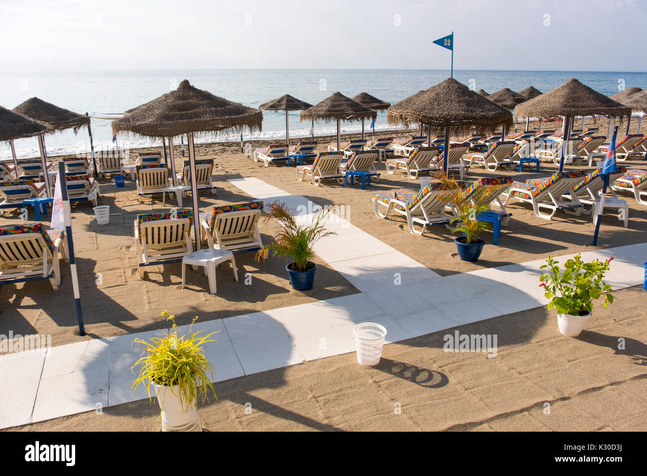 Straw umbrellas & Hammock, beach, Fuengirola. Malaga province Costa del Sol. Andalusia southern, Spain Europe Stock Photo
