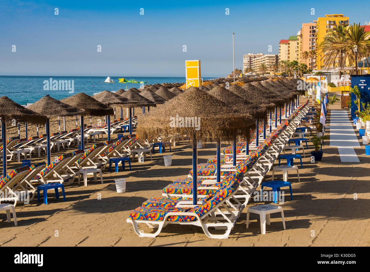 Straw umbrellas & Hammock, beach, Fuengirola. Malaga province Costa del Sol. Andalusia southern, Spain Europe Stock Photo