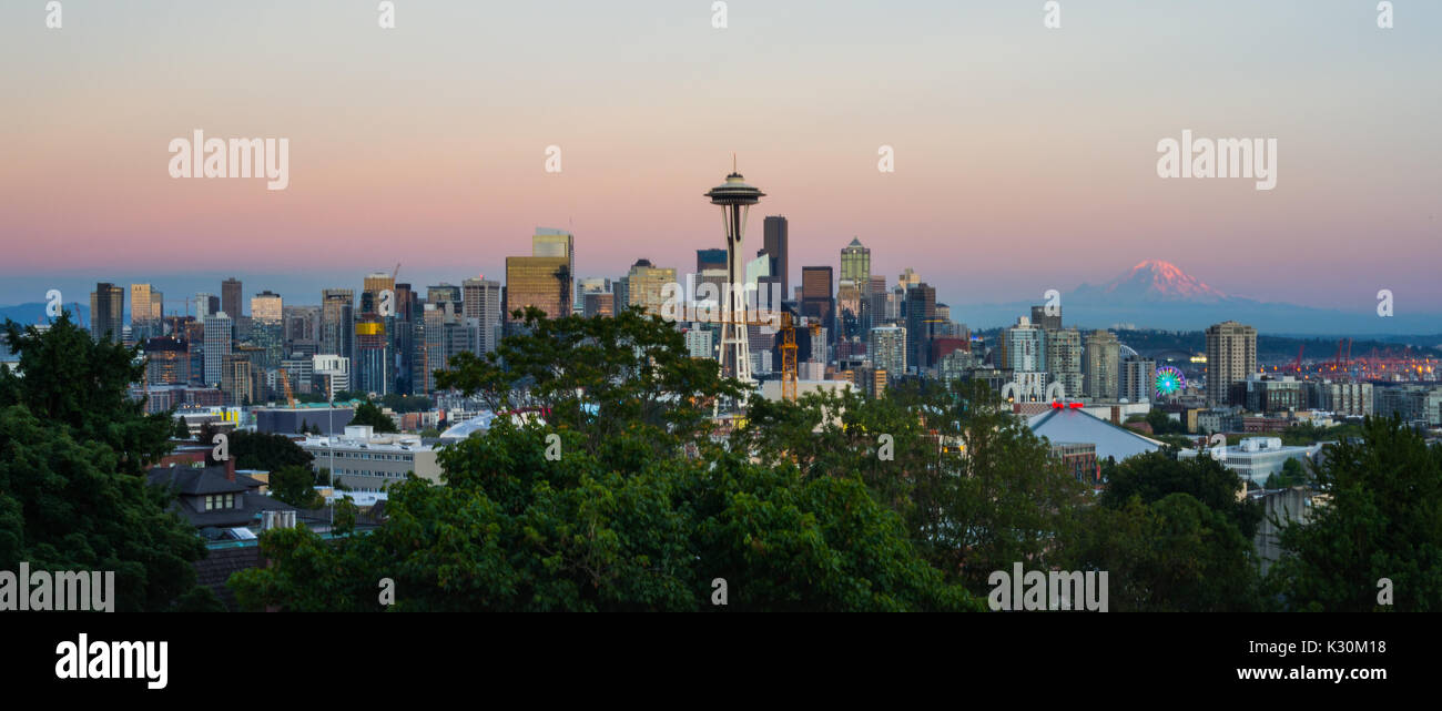 This is the picture of Seattle skyline with Mount Rainier in the background during sunset. Stock Photo