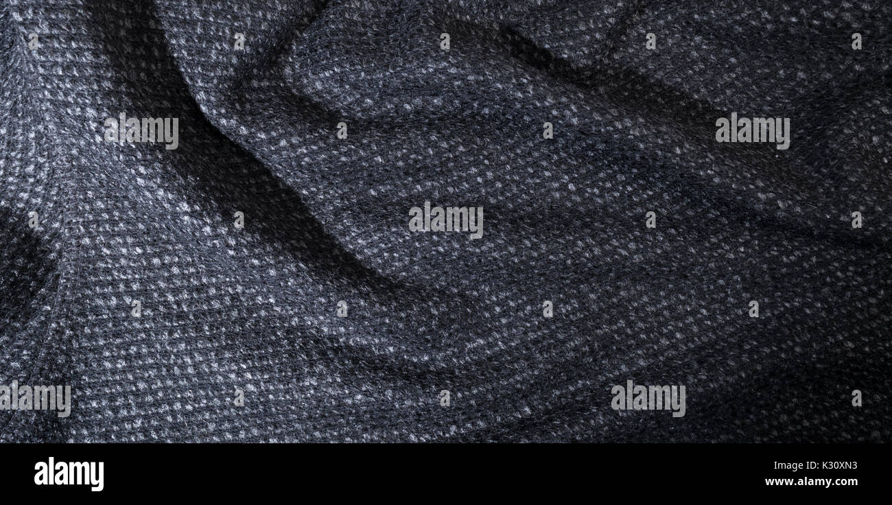 waving cotton gray fabric, textile background. Stock Photo