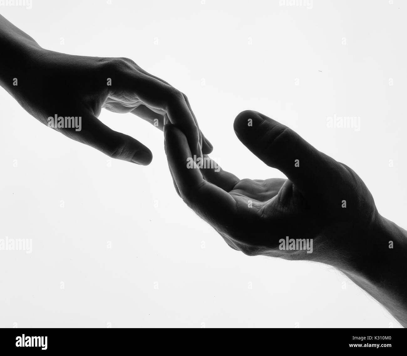 Man woman hold hands silhouette white background Stock Photo - Alamy