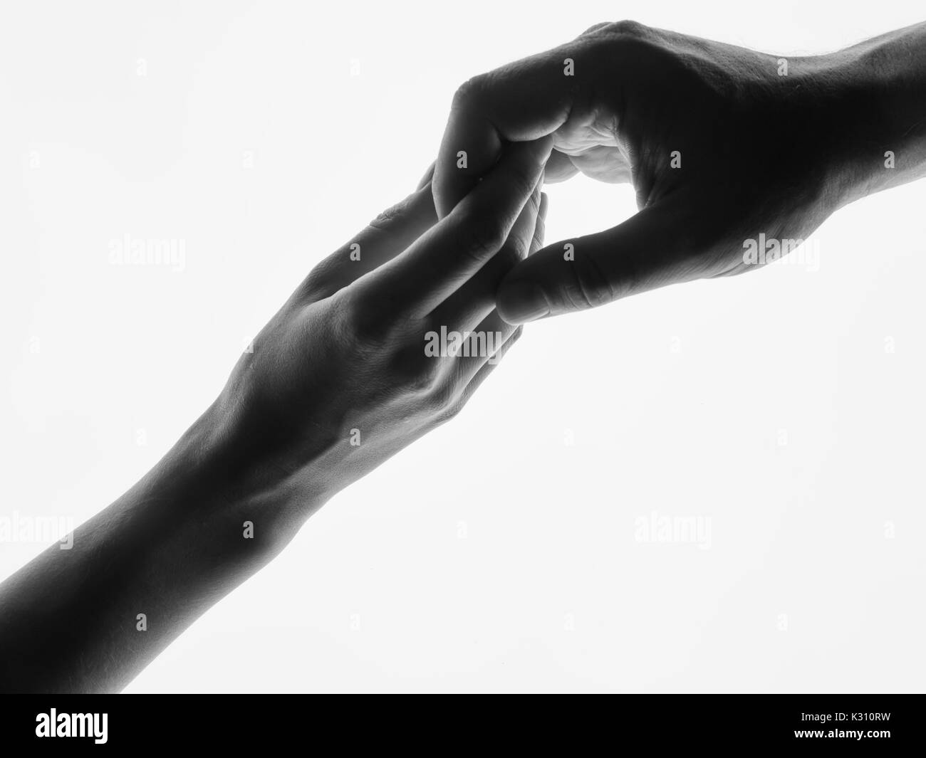Man woman hold hands silhouette white background. Stock Photo