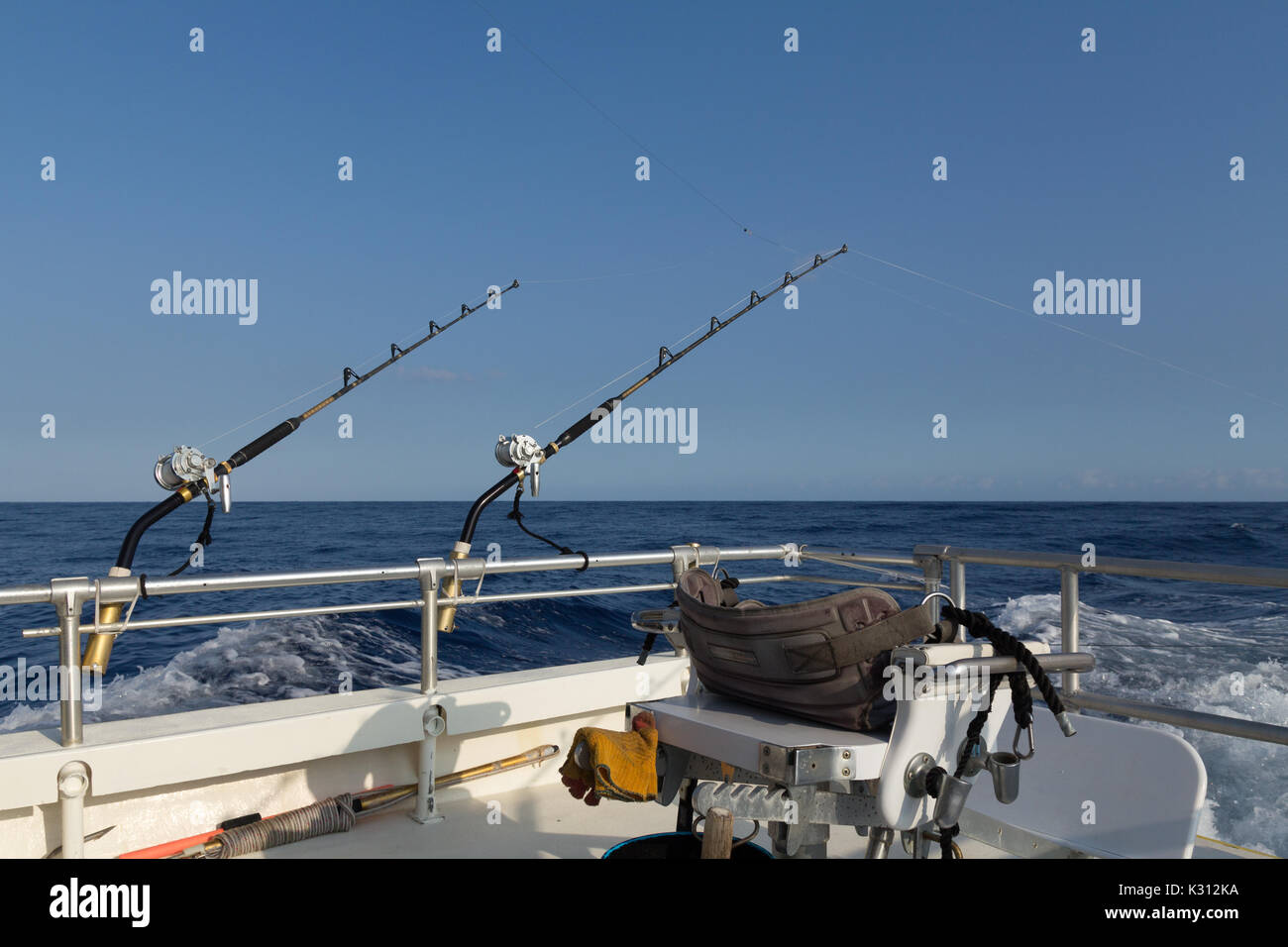 Fighting chair with fishing gear on offshore deep sea fishing boat in  Pacific Ocean Stock Photo - Alamy