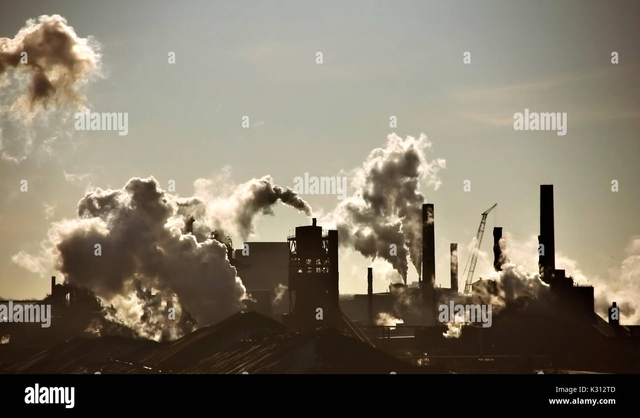 Steel-mill plant scenery line with fuming chimney-stalks in Hamilton Ontario Stock Photo