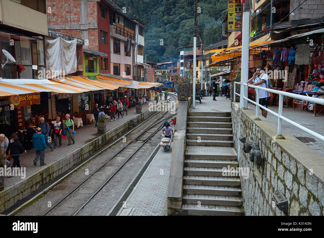 Railway lines through the middle of restaurants at Aguas Calientes, Sacred Valley, Peru, South America Stock Photo