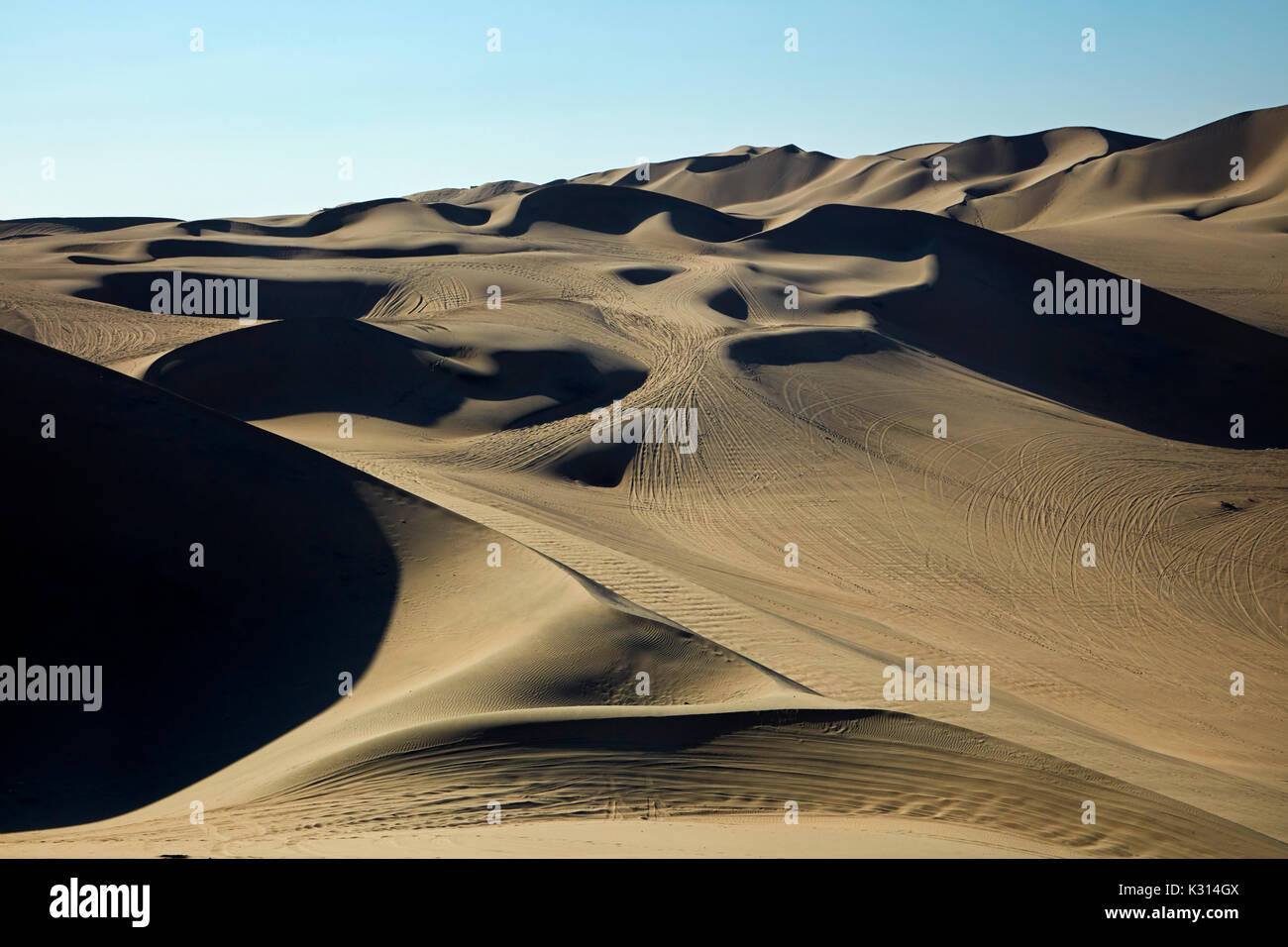 Dune buggy tracks on sand dunes in desert near Huacachina Oasis, Ica, Peru, South America Stock Photo