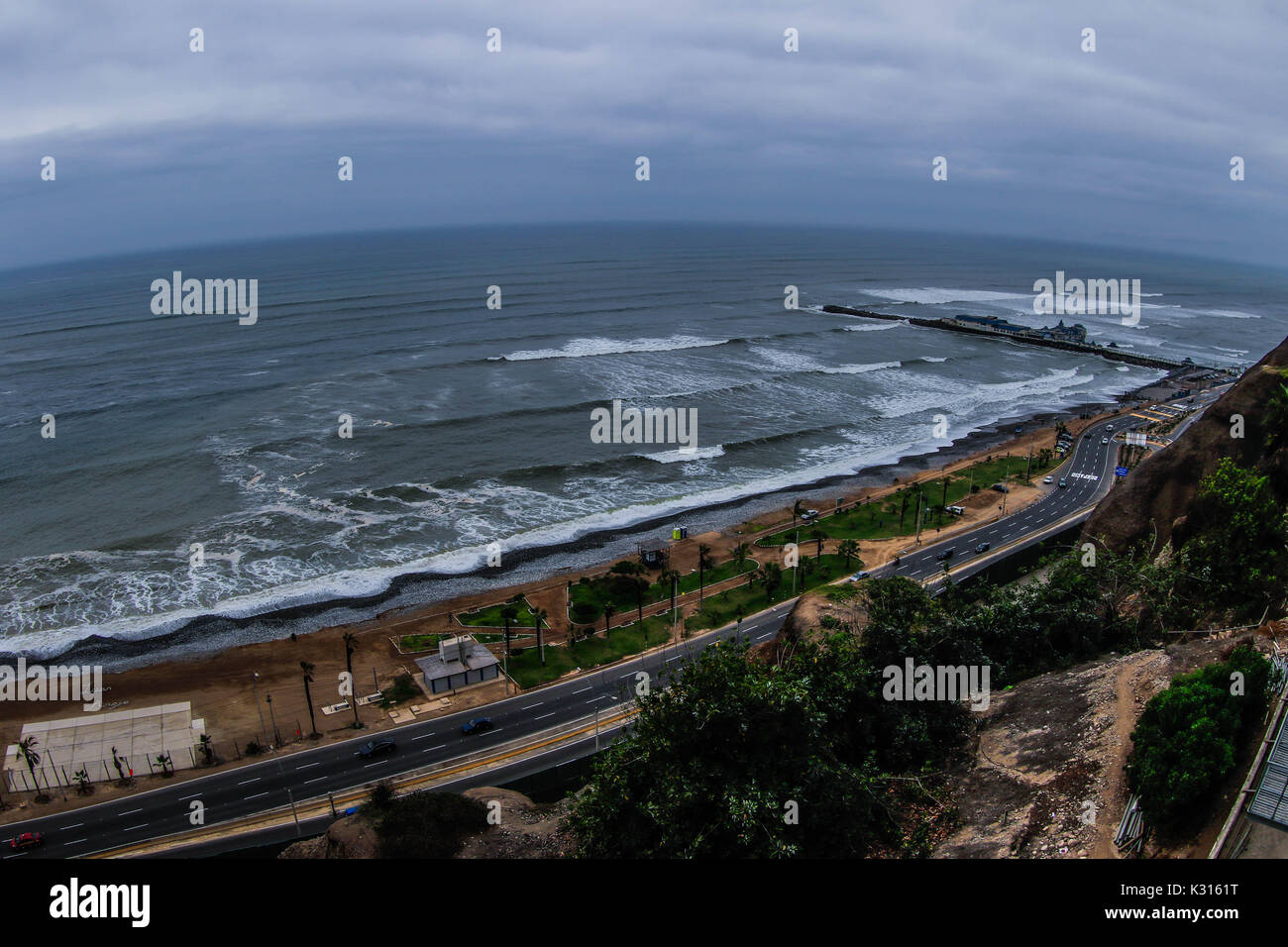 Surf, lookout and dock of the Waikiki beach of the tourist area of Miraflores in the capital city of Lima in Peru. Surfers, waves, sea, ocean open sea Stock Photo