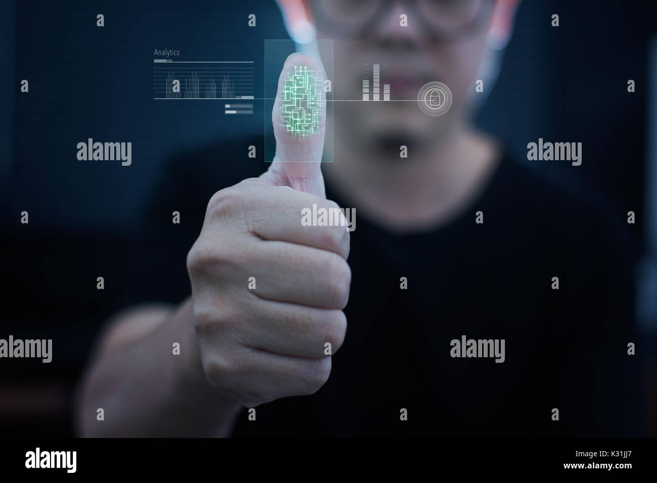 Young businessman scan fingerprint for identity analytics , concept of the internet and future immersive technology for business security . Stock Photo