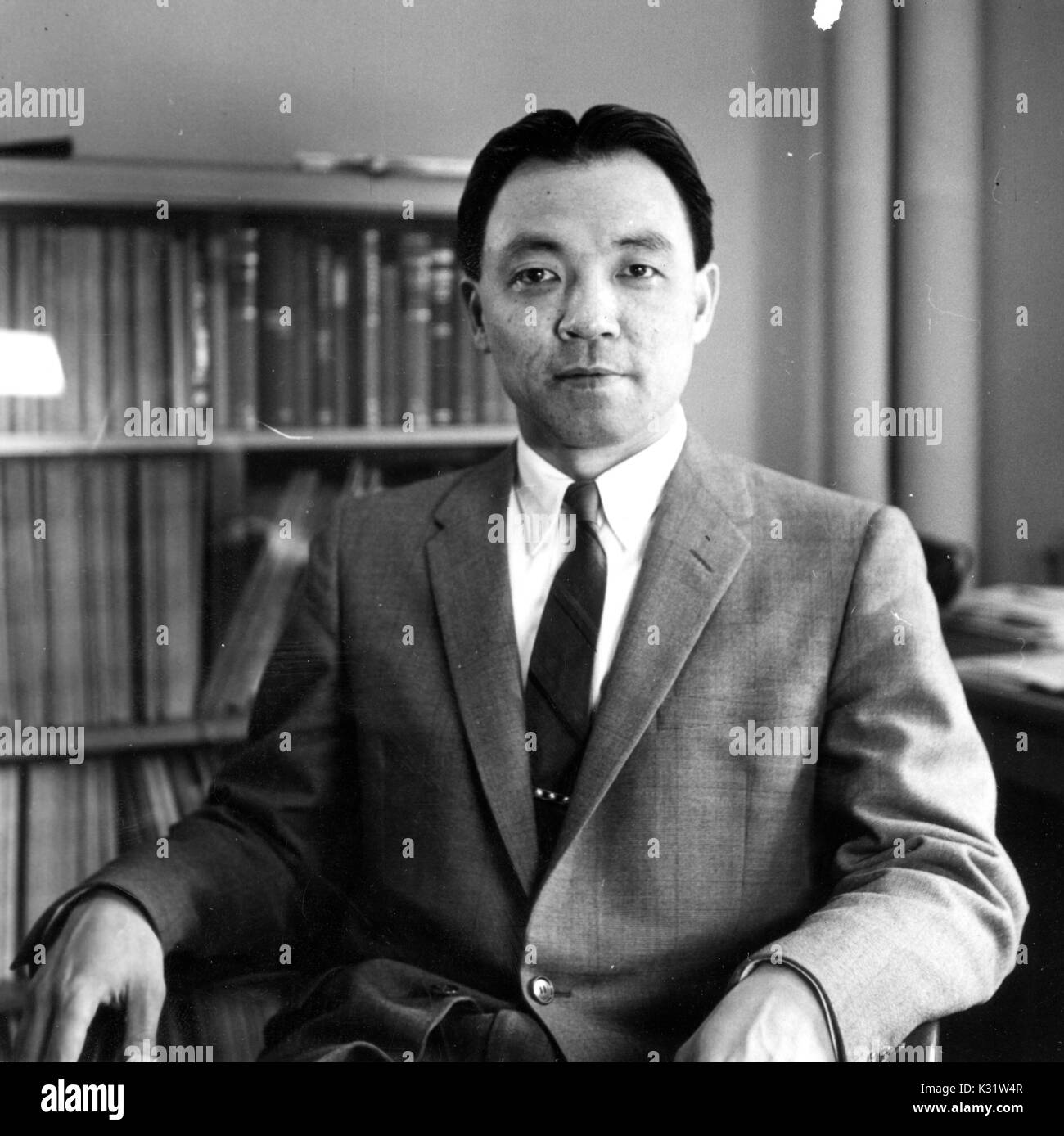 Mathematician Wei-Liang Chow sits in an office at Johns Hopkins University, where he was a professor, in Baltimore, Maryland, 1955. Stock Photo