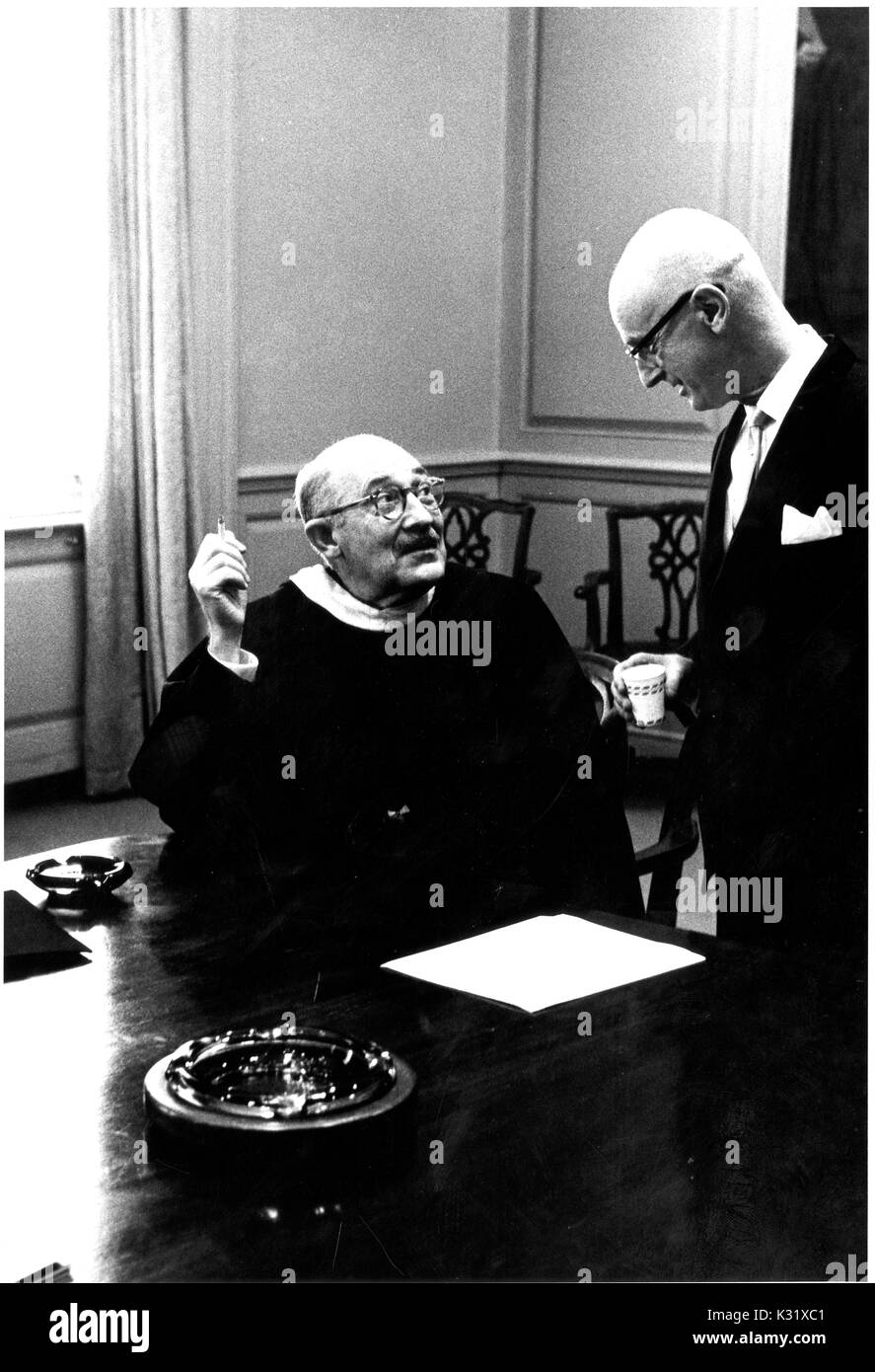 Executive Vice-President of Johns Hopkins University P. Stewart Macaulay (left) has a conversation with host of the Johns Hopkins Science Review Lynne Poole (right) during the university's commemoration day, celebrating the university's founding, in Baltimore, Maryland, February 22, 1963. Stock Photo