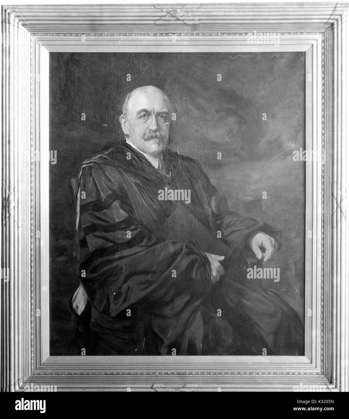 A painting of William Bullock Clark, a professor of geology at Johns Hopkins University, sitting and wearing a dark robe, 1918. Stock Photo