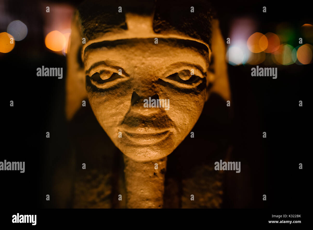 Egyptian pharaoh statue is a closeup head shot of a small Egyptian ...