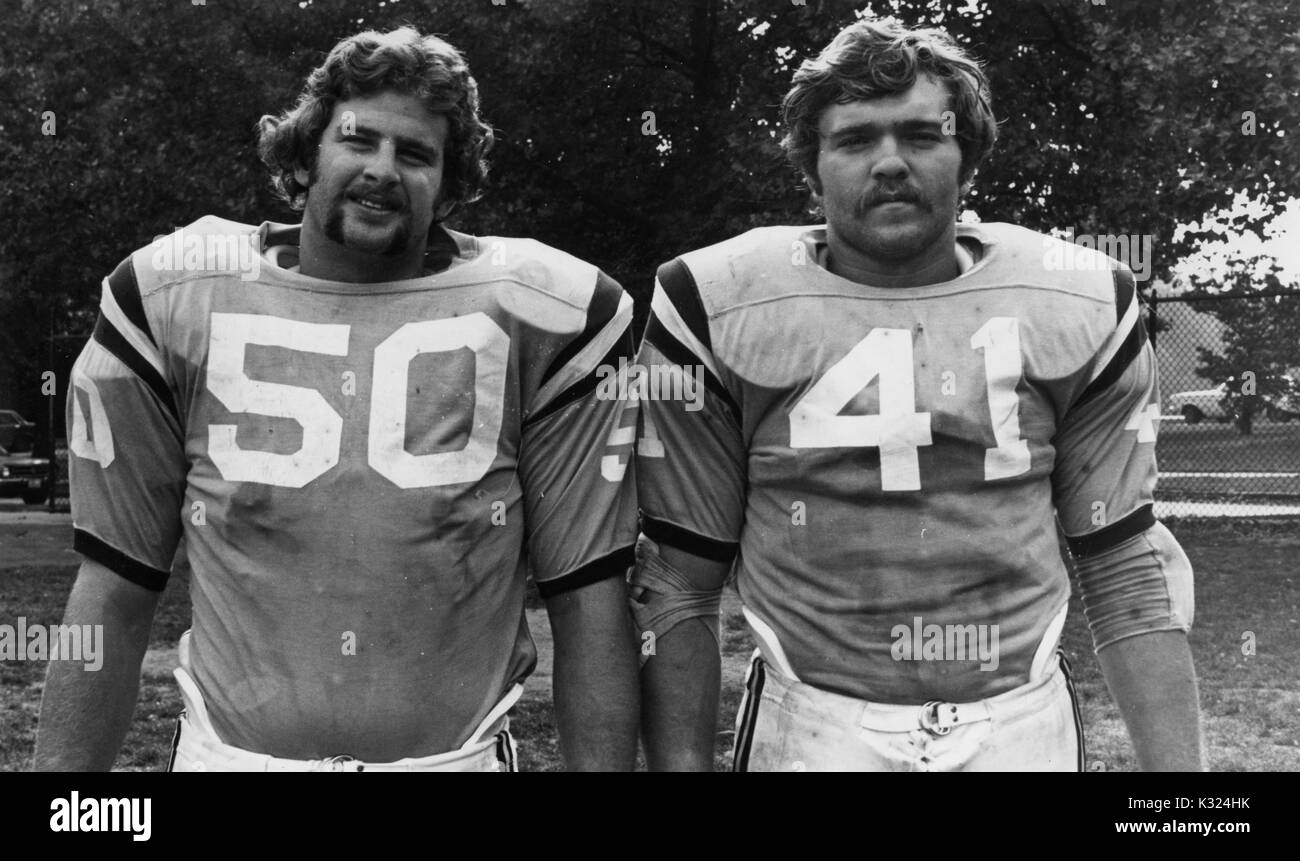 Half-length standing portrait of two Johns Hopkins University football players standing on a field, 1970. Stock Photo