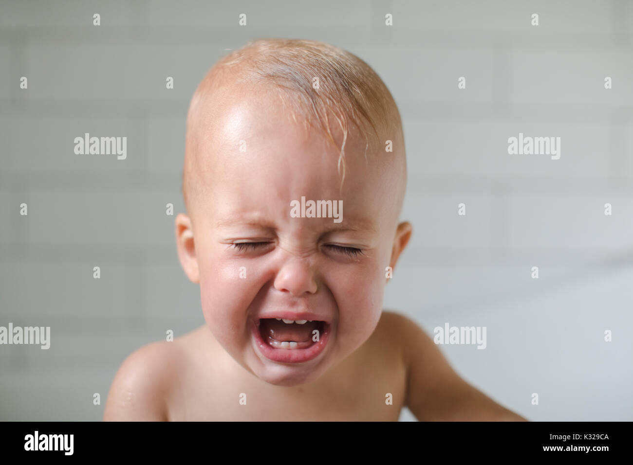 Photo of one-year-old baby cries close-up Stock Photo