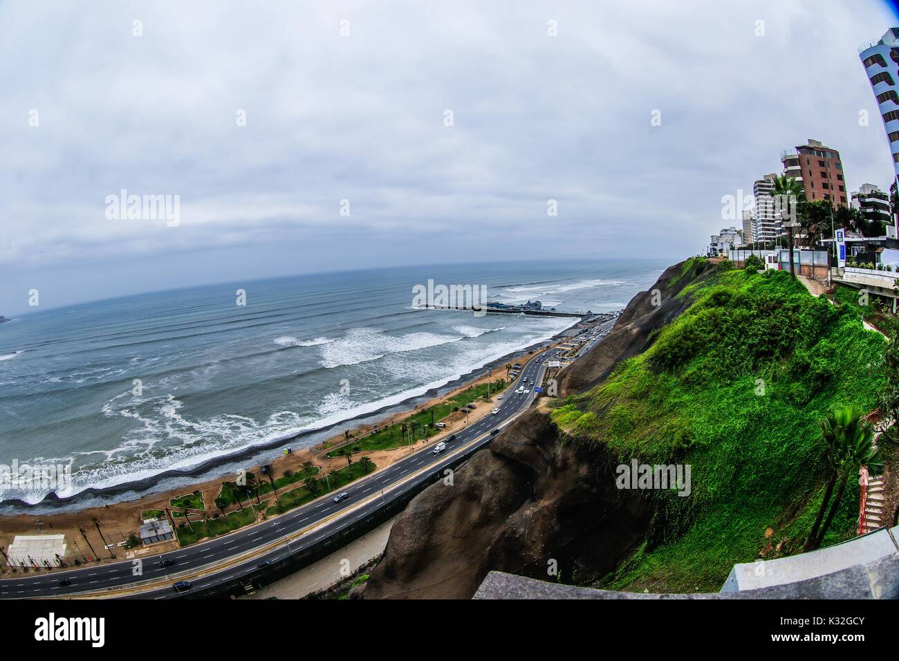 Surf, lookout and dock of the Waikiki beach of the tourist area of Miraflores in the capital city of Lima in Peru. Surfers, waves, sea, ocean open sea Stock Photo