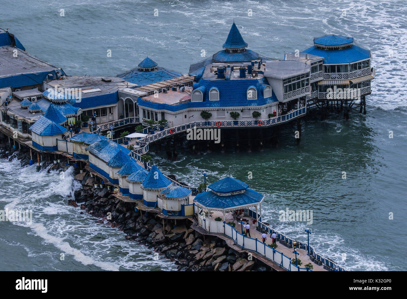 Surf, lookout and dock of the Waikiki beach of the tourist area of Miraflores in the capital city of Lima in Peru. Surfers, waves, sea, ocean open sea Stock Photo