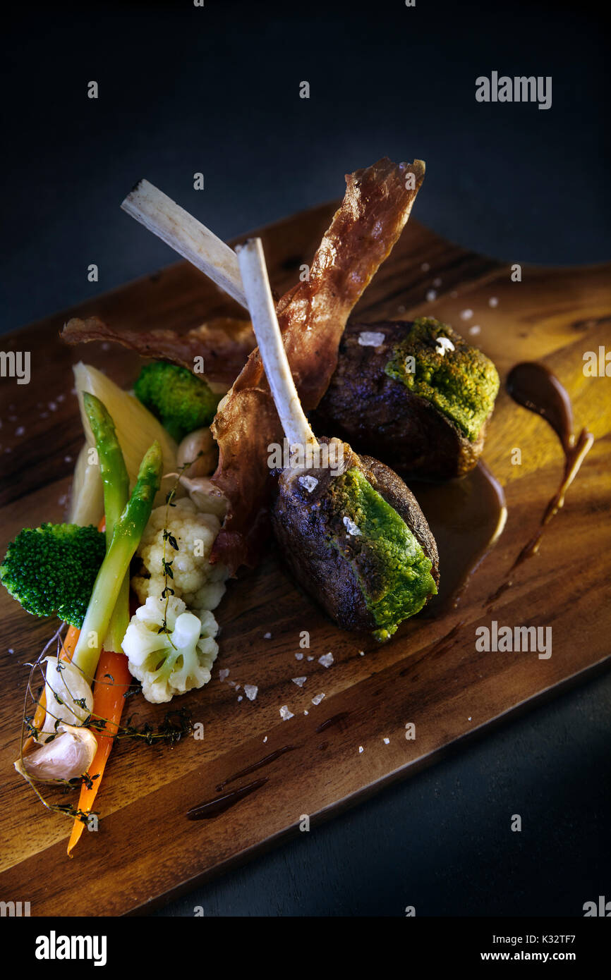 A beautifully prepared lamb chop dish served at a restaurant at the
