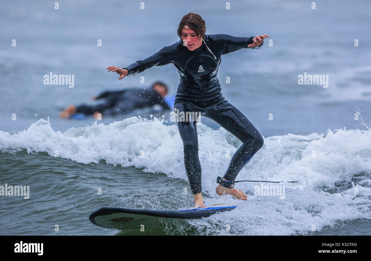 Surfing at Waikiki Beach in the tourist area of Miraflores in the capital city of Lima in Peru. Surfers, waves, sea, blue, ocean. sea South Pacific Stock Photo