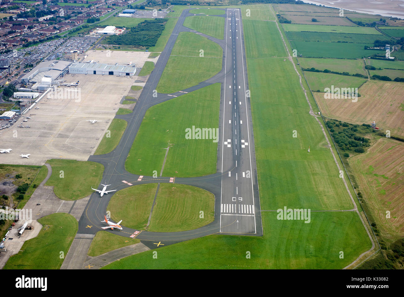 Looking down the runway at Liverpool John Lennon Airport, Merseyside, North West England Stock Photo