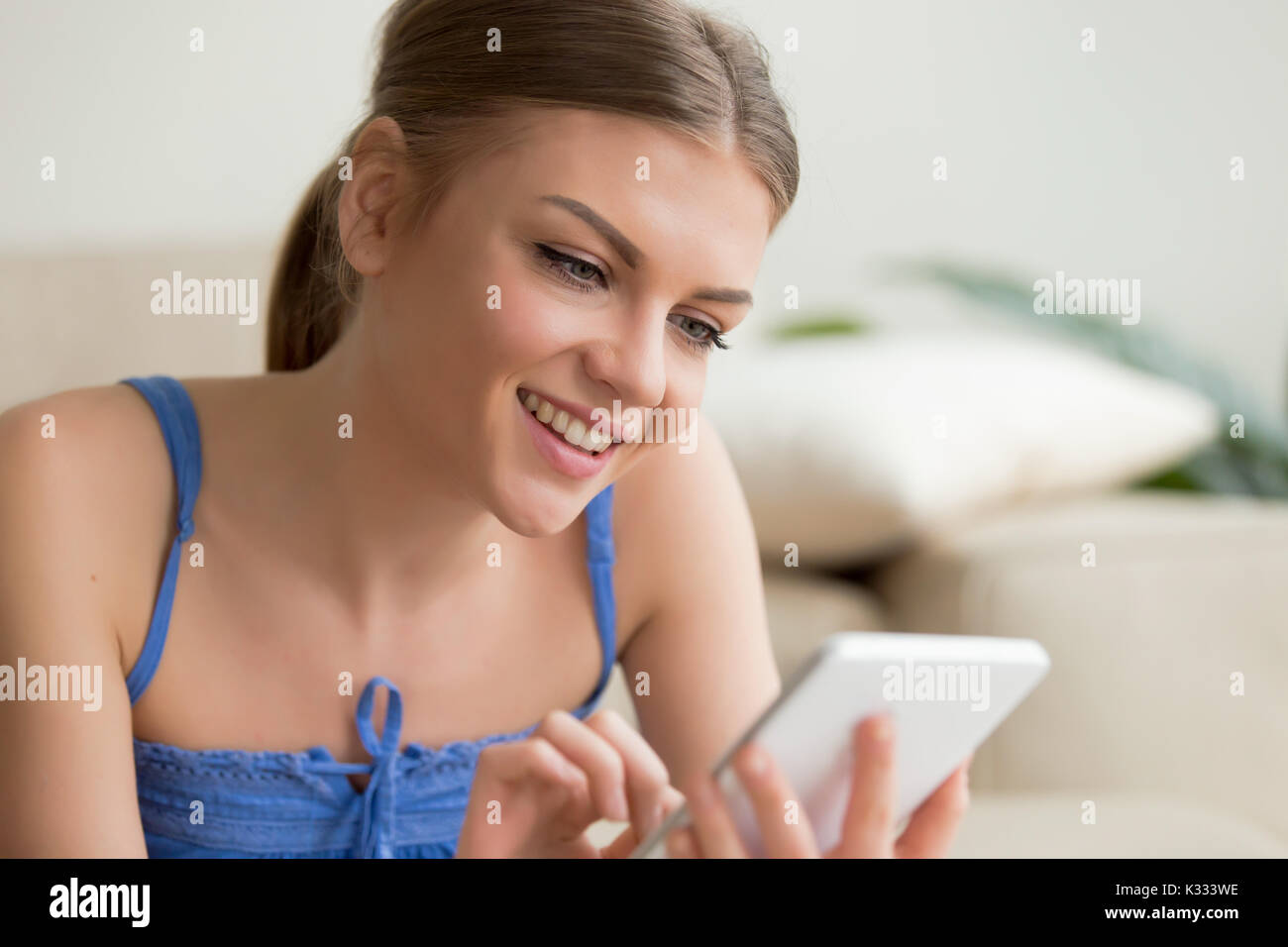 Portrait of cute young woman using digital tablet Stock Photo