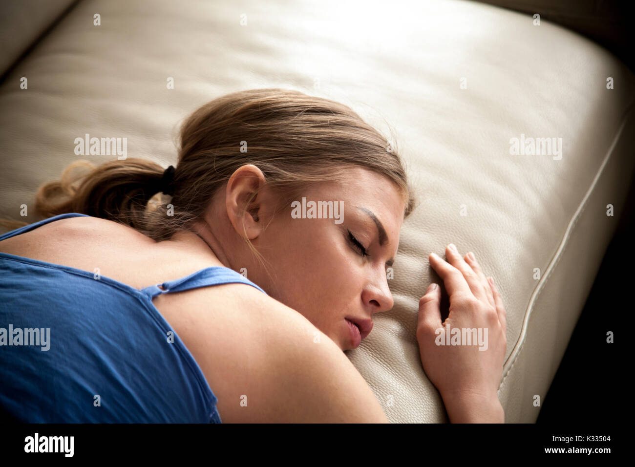 Tired lady falling asleep after sleepless night Stock Photo