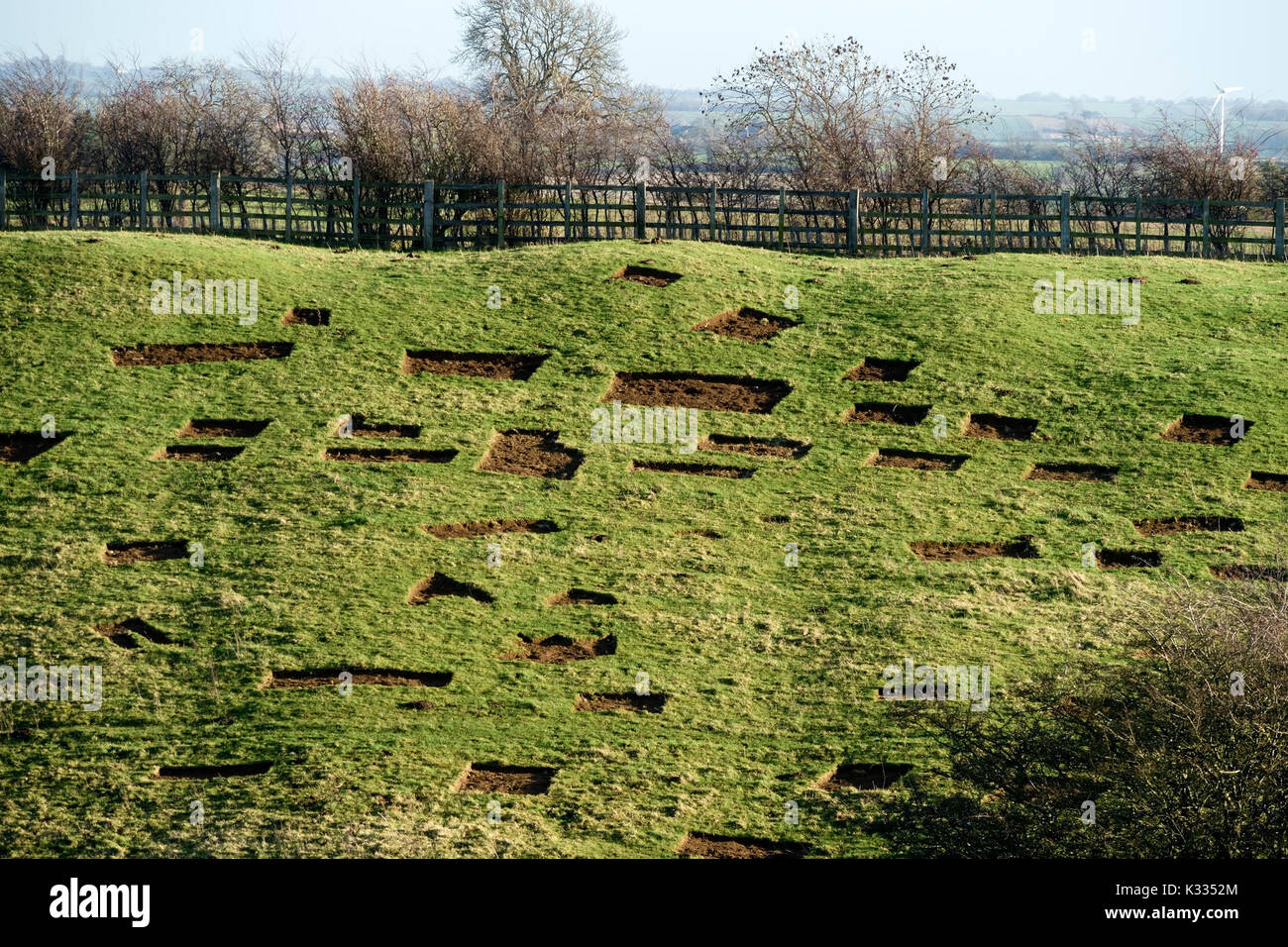 Removed grass turf patches for erosion repair of banks of ancient monument nearby, Iron age hill fort, Burrough Hill, Leicestershire, England, UK Stock Photo