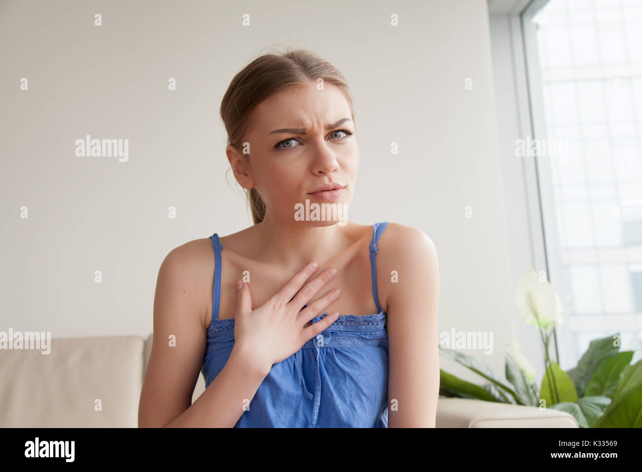 Young woman worried because of compliment Stock Photo