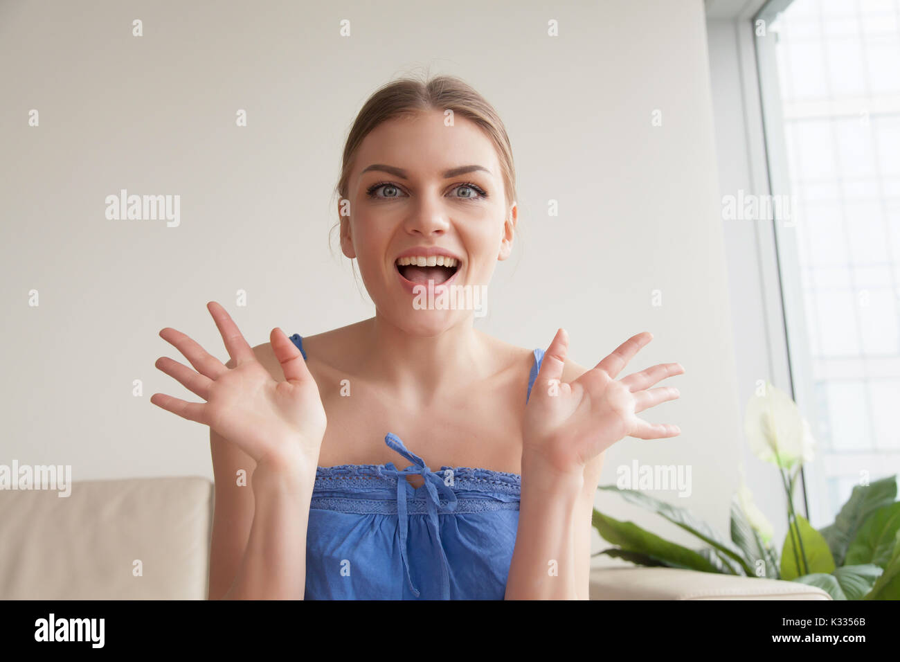Portrait of excited woman looking at camera Stock Photo