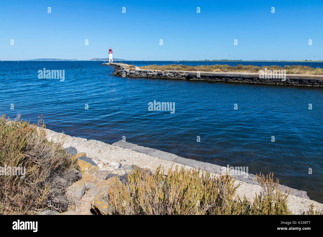 The Les Onglous lighthouse, terminating point of the Canal du Midi where the it enters the Etang de Thau. World Heritage Site. Agde, France Stock Photo