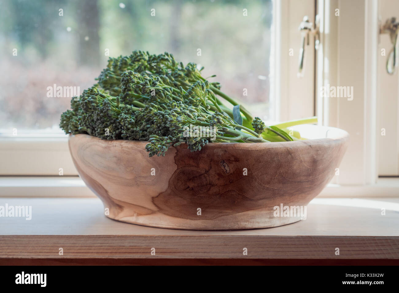Raw wild broccoli Cime di Rapa in bowl made of olive wood Stock Photo ...